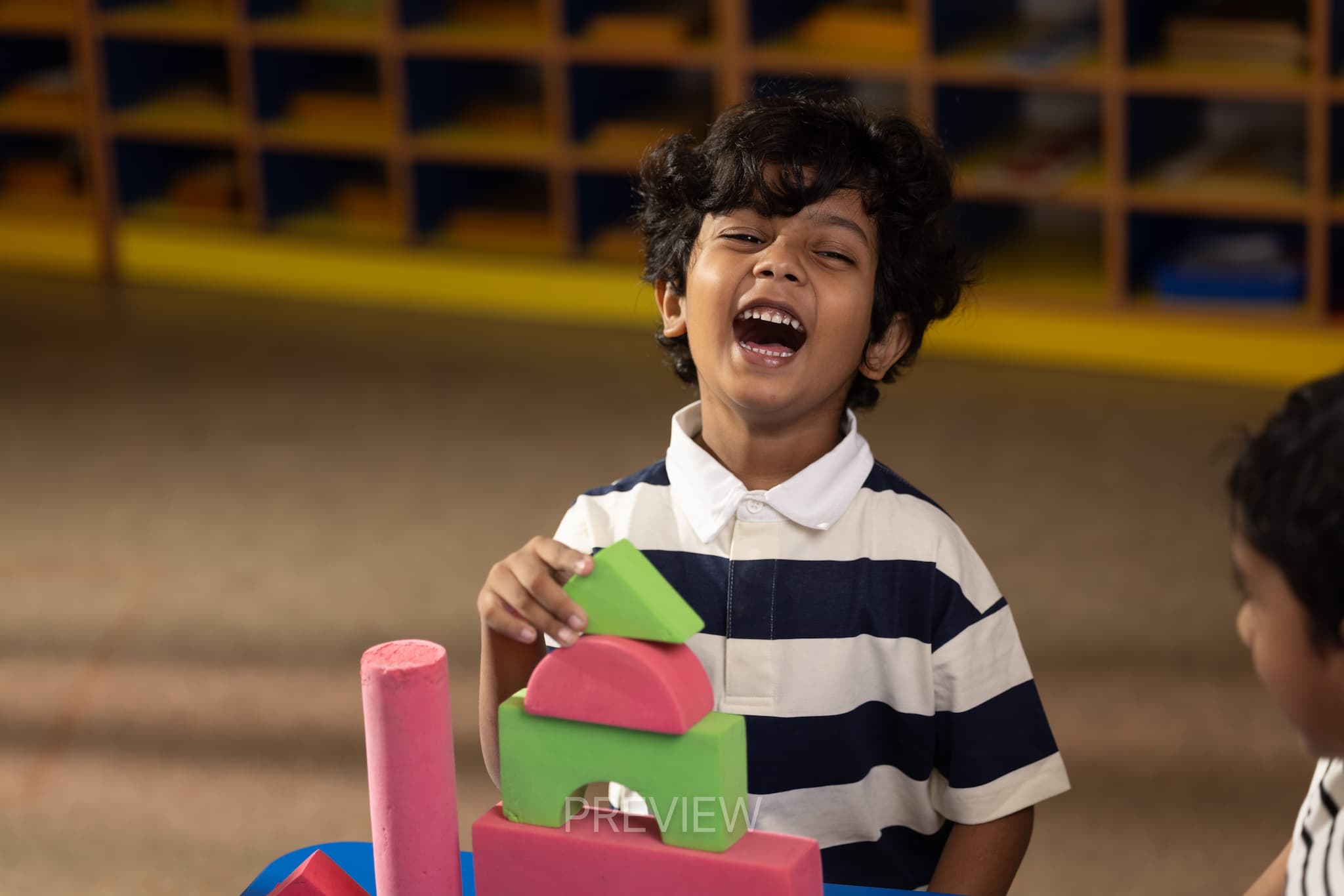 IB Student Playing with Blocks